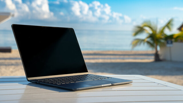 Remote working with Laptop on a beach