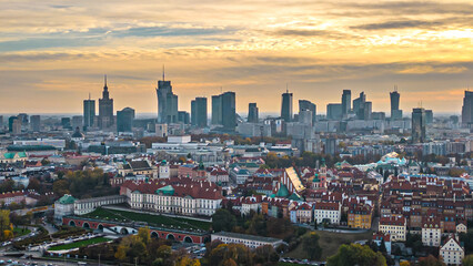 Warsaw at sunset. The capital of Poland is illuminated by a beautiful orange sun. Panorama of Old...