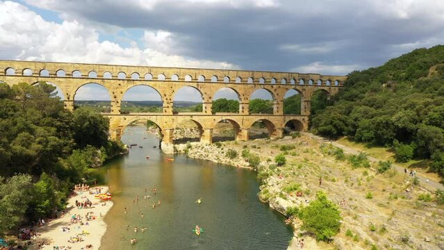 Aerial of Pont du Gard roman aqueduct with Beach France