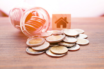 Coins in a jar, close-up, money saving concept (spot focus)