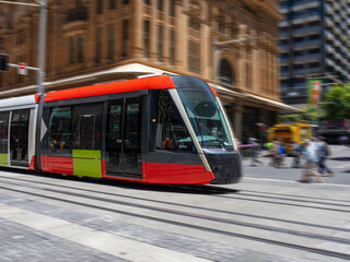 Tram moving through George in CBD Sydney NSW Australia