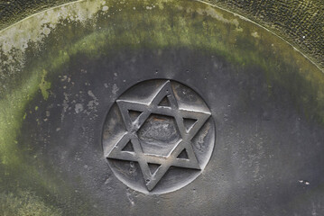 Star of David on a tombstone in a Jewish cemetery.