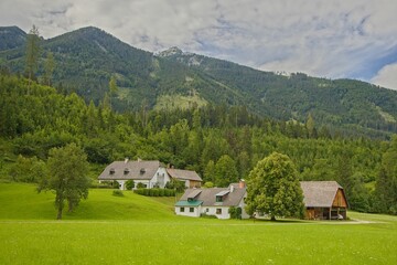A farm in the alpine countryside in the middle of mountains, Austria