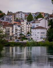 Riverbanks of the Gave de Pau river in the pilgrimage city of Lourdes in the French Pyrenees