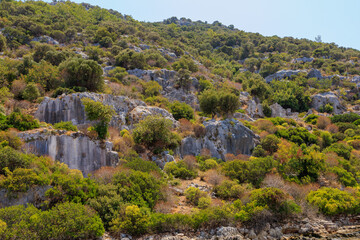 Fototapeta na wymiar The ruins of a sunken ancient city on the island of Kekova Lycian Dolichiste in Turkey in the province of Antalya