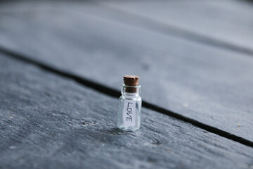 Love concept. A bottle with the inscription love. Vintage style.