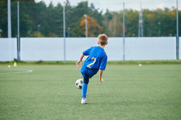 The boy plays soccer