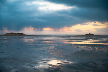 Wadden sea at low tide, North sea beach landscape, coast on Romo island in Denmark at sunset,...