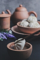Fototapeta na wymiar Chinese dim sum dumpling with chinese tea set ceremony 