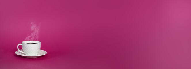 Isolated white cup mug with a hot coffee tea with steam on a pink background. A beautiful romantic extra wide banner with copy space. Minimalism style, blank gradient background, free space for text