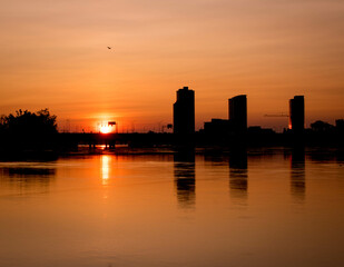 sunrise.sunrise over the city of montreal.background panorama scenic of the strong sunrise and cloud on the orange sky.Evening cloudscape in city