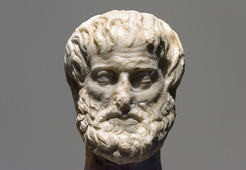 Marble head of Greek philosopher Aristotle isolated on gray