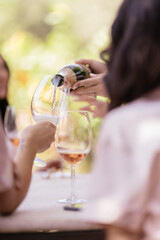 wine or champagne pouring in wine glass. concept for drink and beverage.