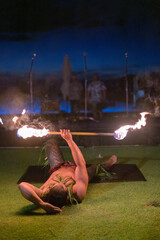 fire show, dancing with flame, male master fakir with fire works, performance outdoors.