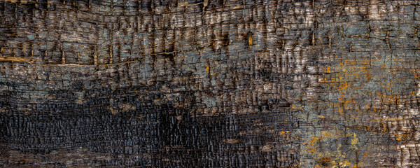 Old rough and burned wooden texture background