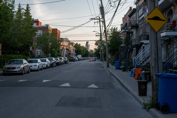 District Verdun Montreal.Downtown Montreal Street illuminated in first golden morning light at sunrise in summer, Quebec,Canada. city sunlight warm orange