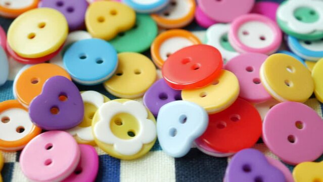 wooden color Plastic buttons on white background 