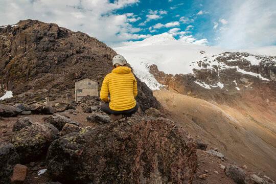 man watching the cayambe volcano in ecuador