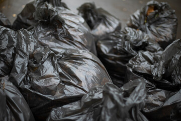 Black garbage bags. Cleaning on street. Waste bags. Black plastic. © Олег Копьёв