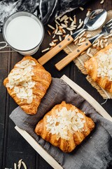 freshly croissants on grey wooden table