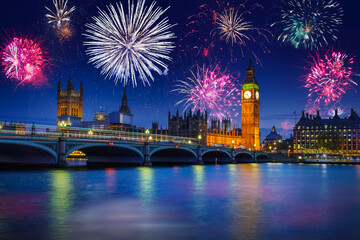 Fototapeta na wymiar New years fireworks display over the Big Ben and Westminster Bridge in London, UK