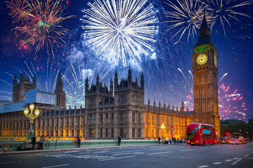 New years fireworks display over the Big Ben and Westminster Bridge in London, UK