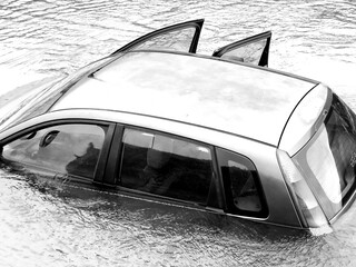 Damaged Car flooded in the river - Flood Disaster