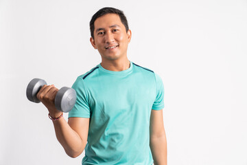 asian man lifting dumbbells while exercising biceps on white background