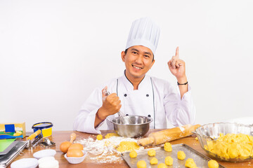 Male Chef with Movement Pointing his fingers when using a whisk in a stirring bowl in the isolated background