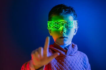 Boy in smart goggles touching invisible screen