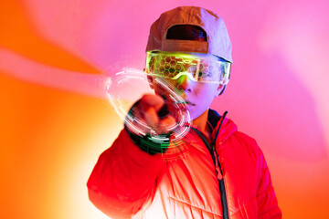 Futuristic boy interacting with digital interface