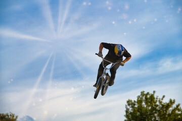 bmx bike in the sky space, exhilaration, park, racey, motion, adventure, ramp high, flight, black, concrete, fly, pursuit, culture, flying, recreational fast