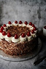 Homemade Black forest cake topped with fresh cherries, selective focus