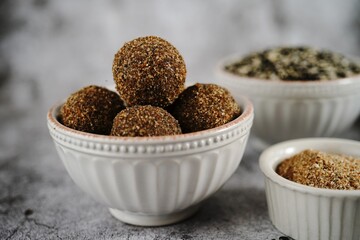 High protein energy balls with black lentils | Urad daal laddu, served in a bowl