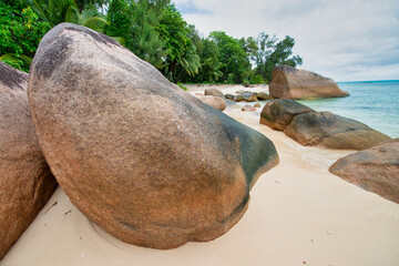 Fototapeta na wymiar Amazing picturesque paradise beach with granite rocks and white sand, Seychelles travel concept