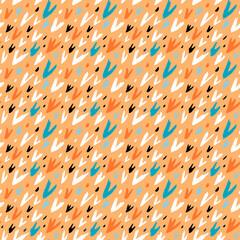Color pattern on an orange background. Abstract brush strokes drawn by hand. Seamless vector image.