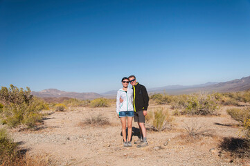 Fototapeta na wymiar happy couple in desert landscape