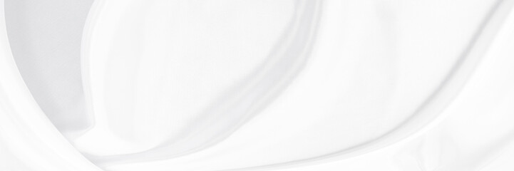White gray satin texture that is white silver fabric silk panorama background with beautiful soft blur pattern natural.