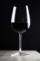 Glass of red wine on dark backgroud
