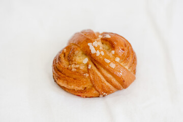 Puff pastry with sprinkles on a white background. Sweet pastries