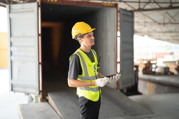 Portrait of caucasian worker working in large warehouse store industry.Rack of stock storage. Interior of cargo in logistic concept. Depot. People lifestyle. Shipment service for container