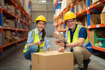 Teamwork group of Asian man worker working in large warehouse retail store industry factory. Rack of stock storage. Cargo in ecommerce and logistic concept. Depot. People lifestyle. Shipment service.
