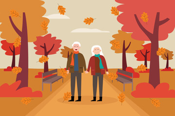 Senior couple walking together in the park with autumn season