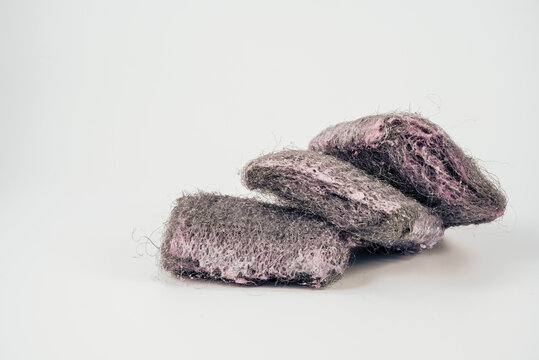 three stacked scouring steel wire wool pads isolated on a white background