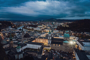 Naklejka premium Beautiful of Aerial panoramic winter view of historic Salzburg, Austria, with Salzach river, Christmas markets and dramatic sky - Medium - Landscape