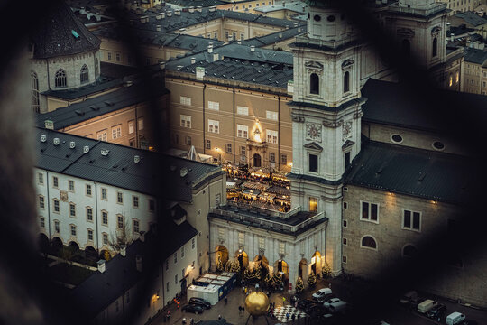 Aerial shot of Christmas market in Domplatz, Salzburg, Austria, from Fortress Hohensalzburg at dusk - wide
