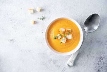 Sweet potato soup with croutons and thyme leaves