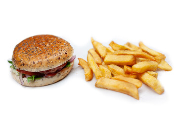 Tasty, fresh hamburger with french fries on a white table unhealthy food