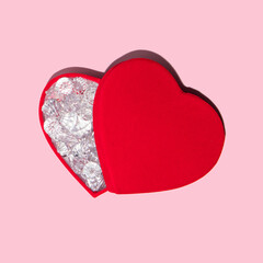 Heart full of diamonds on pastel light pink background. Modern Valentine's Day concept. Creative love idea. Minimalistic Mother's Day composition.