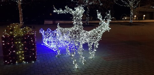 New Year's luminous carriage with reindeer